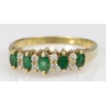 14ct emerald and diamond set half eternity ring, finger size R, weight 5.4g