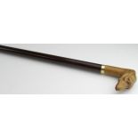 Walking Cane. An early 20th Century walking cane with carved handle depicting a greyhound dog,