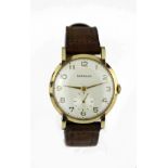 Gents 9ct cased wristwatch by Garrard circa 1957. The cream dial with gilt arabic numerals and