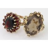 Two 9ct dress rings, one garnet cluster and one smoky quartz, weight 11.6g