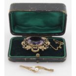 Two brooches, 9ct yellow gold triple pearl brooch and yellow metal and purple stone brooch. Weight