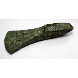 British Palstave Bronze Axe Head. C, 2500-1300 BC. Central raised rib to flared blade. Pitted