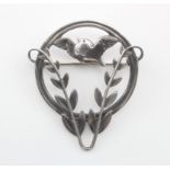 Silver Georg Jensen brooch (no. 258), depicting a songbird & foliage, makers marks stamped to