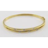 18ct yellow gold hinged split front bangle set with diamonds, weight 15.1g