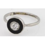Platininum solitaire diamond ring (approx .5ct), with a black circular surround. Size M
