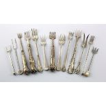 Thirteen silver & white metal pickle forks, length 9-14cm approx., total weight 125g approx.