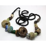Saxon-Germanic Dark Ages necklace. C, 6th century AD. A selection of glass and coloured stone