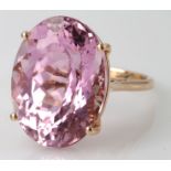 14ct rose gold single stone ring set with natural oval Brazillian Kunzite weighing 25.03ct. Finger