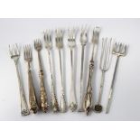 Ten large silver & white metal pickle forks, length 12-20cm approx., total weight 205g approx.