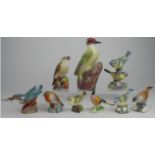 Royal worcester. A collection of eight Royal Worcester figures, comprising Woodpecker (3249); Blue