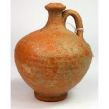 Roman Terracotta Flagon. C, 100 AD. Areddy coloured clay with out turned rim and single handle.