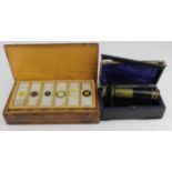 Small R & J Beck folding brass & black laquered microscope (no. 40025), in original case (some