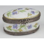 Limoges. A french oval trinket box by Limoges, with hallmarked silver mounts & hand painted floral