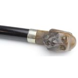 Walking Cane. A walking cane with carved knop, depicting a monkey head, circa late 19th to early