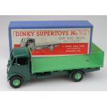Dinky Supertoys, no. 513 'Guy Flat Truck with Tailboard' (1st type), dark green cab & chassis, mid