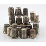 Twenty silver thimbles (three stamped 'Sterling Silver', one unmarked), includes Advertising /