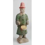 Chinese Ming Dynasty Muscian Tomb Figure. C, 17th century AD. Dressed in a red hat and green