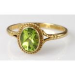 9ct yellow gold oval Peridot solitaire ring, finger size O, weight 1.8g