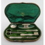 Silver George Unite manicure set, hallmarked 'GU, Birmingham 1906/1907, contained in fitted