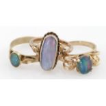 Three 9ct gold rings, one set with an opal doublet two more set with opal triplets, weight 7.8g