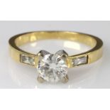 18ct yellow gold ring set with single cubic zirconia and baguette shoulders, finger size P, weight