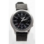 Gents Seiko 5 military automatic wristwatch, the black dial with white arabic numerals with day/date