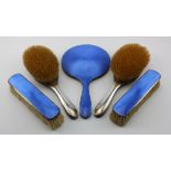 Silver & blue enamel backed five piece dressing table set comprising four brushes and one mirror,