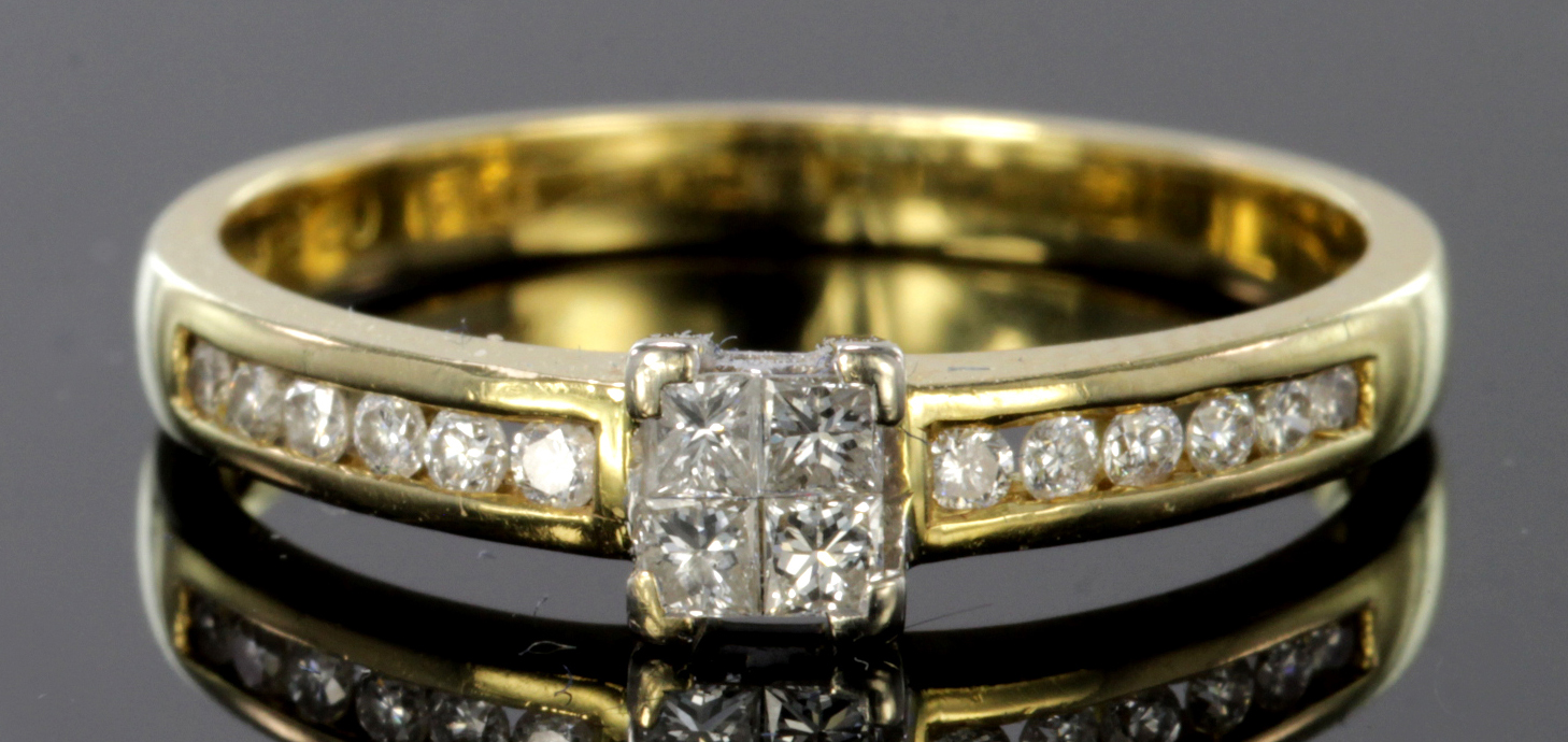 9ct gold ring set with four tension set princess cut diamonds and diamond set shoulders, total
