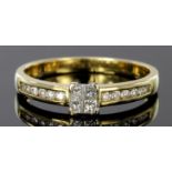 9ct gold ring set with four tension set princess cut diamonds and diamond set shoulders, total