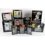 Minichamps. A collection of thirteen boxed Minichamps models, including motorcycles, riders, cars,