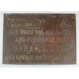 Cast Iron wall plaque (double sided), relating to the renovation of the Devon and Dorset (Dyer)