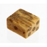 Roman Bone Gaming Dice. C, 1st-4th century AD. Oblong shaped dice with inscribed ring and dots for