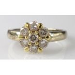 18ct yellow gold seven stone cluster diamond ring with known total diamond weight of 1ct, finger