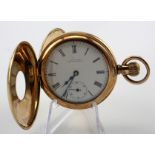 Gents gold plated half hunter pocket watch by Waltham in a Dennison case. The signed white dial with