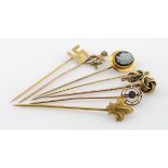 Seven gold/yellow metal hat pins. Total weight 9.5g