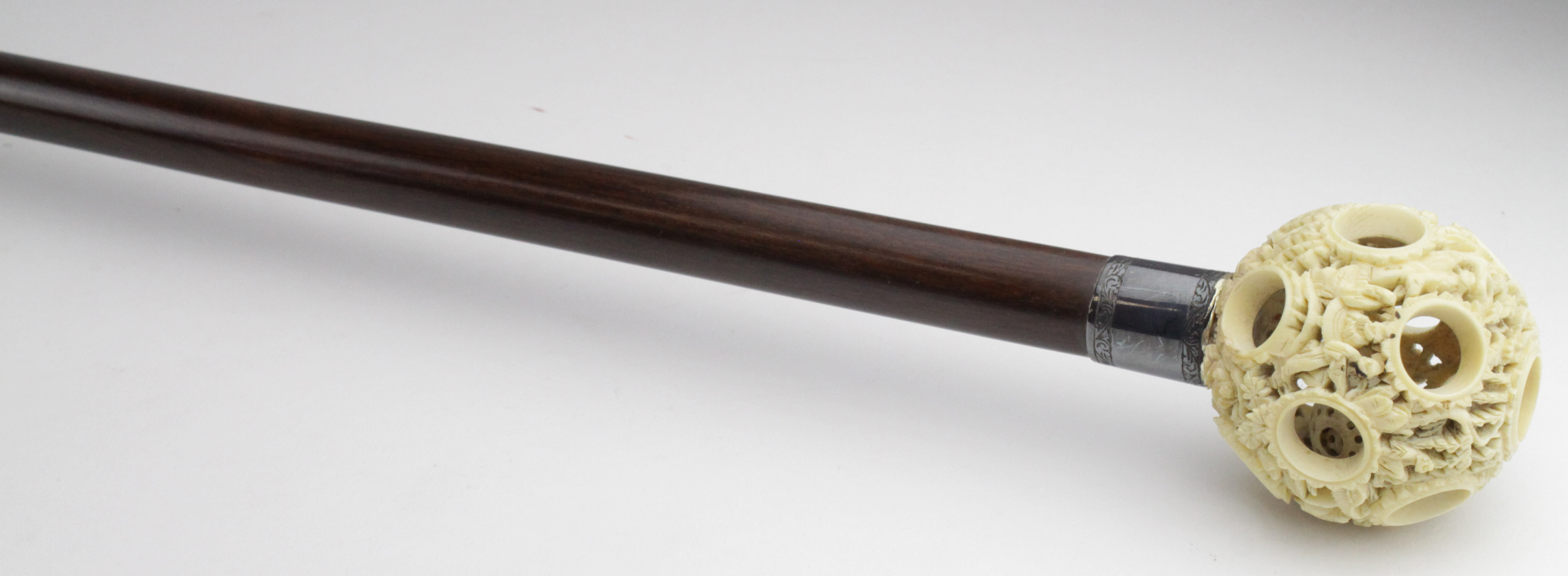 Walking Cane. A walking cane with Japanese puzzle ball knop, circa 19th Century, on rosewood