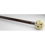 Walking Cane. A walking cane with Japanese puzzle ball knop, circa 19th Century, on rosewood