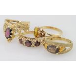 Four 9ct yellow gold gem set rings, weight 10.5g