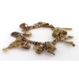 9ct charm bracelet with a good variety of charms attached, total weight 41.9g