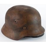 German M35 steel combat helmet, autumn over paint, complete with liner & chinstrap.