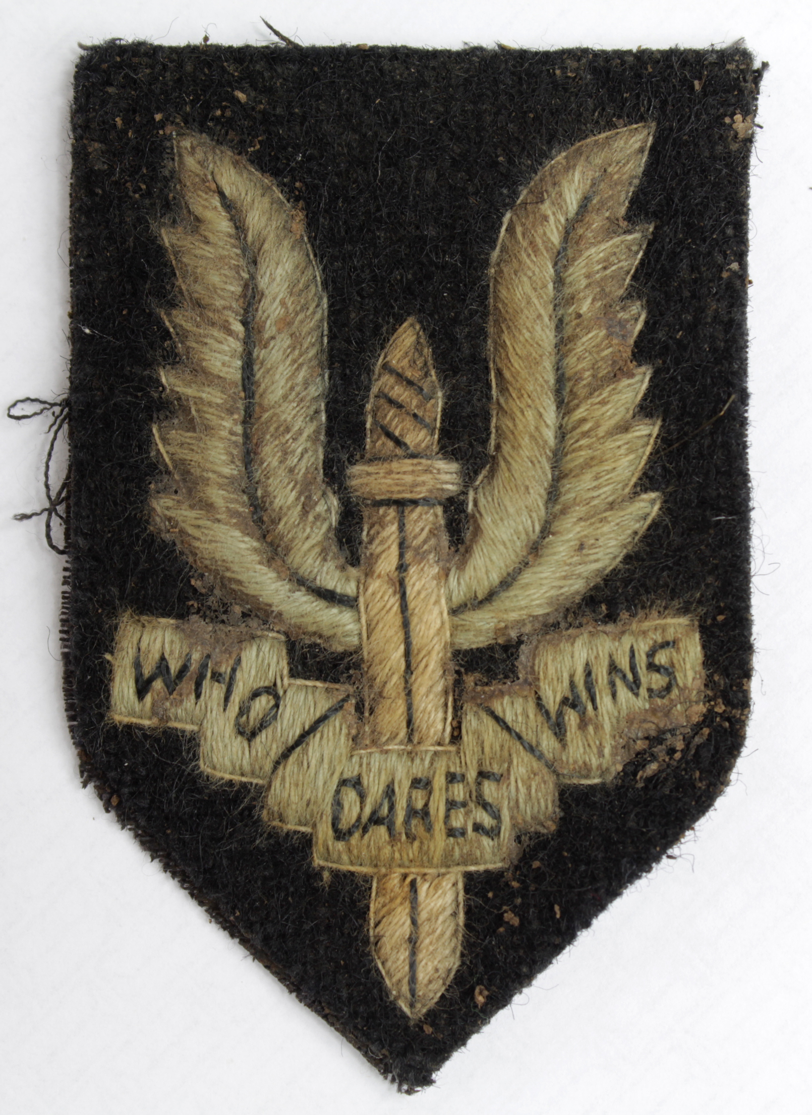 Badge a larger sized WW2 SAS Beret badge, grubby but would clean.