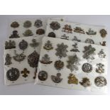 Cap Badges - 4x boards of Infantry Cap badges, with kk numbers. (approx 66)