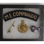 Badges an ME Commando metal cap badge & cloth shoulder title for the same.