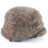 German WWII combat helmet with cloth camo cover, inside marked " Vetter SS A A Pz Gr " and SS