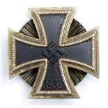 German WW2 Iron Cross 1st class screw back with starburst effect, three piece made, toned