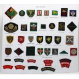 Cloth Badges: Army Cadet Badges on display board - Formation signs and shoulder titles all in