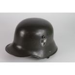 German WW1 1916 pattern helmet complete with lining and chin strap with divisional sign on the