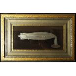 Airship interest. Fine detailed metal model of the R100 tethered to a mooring mast set within a