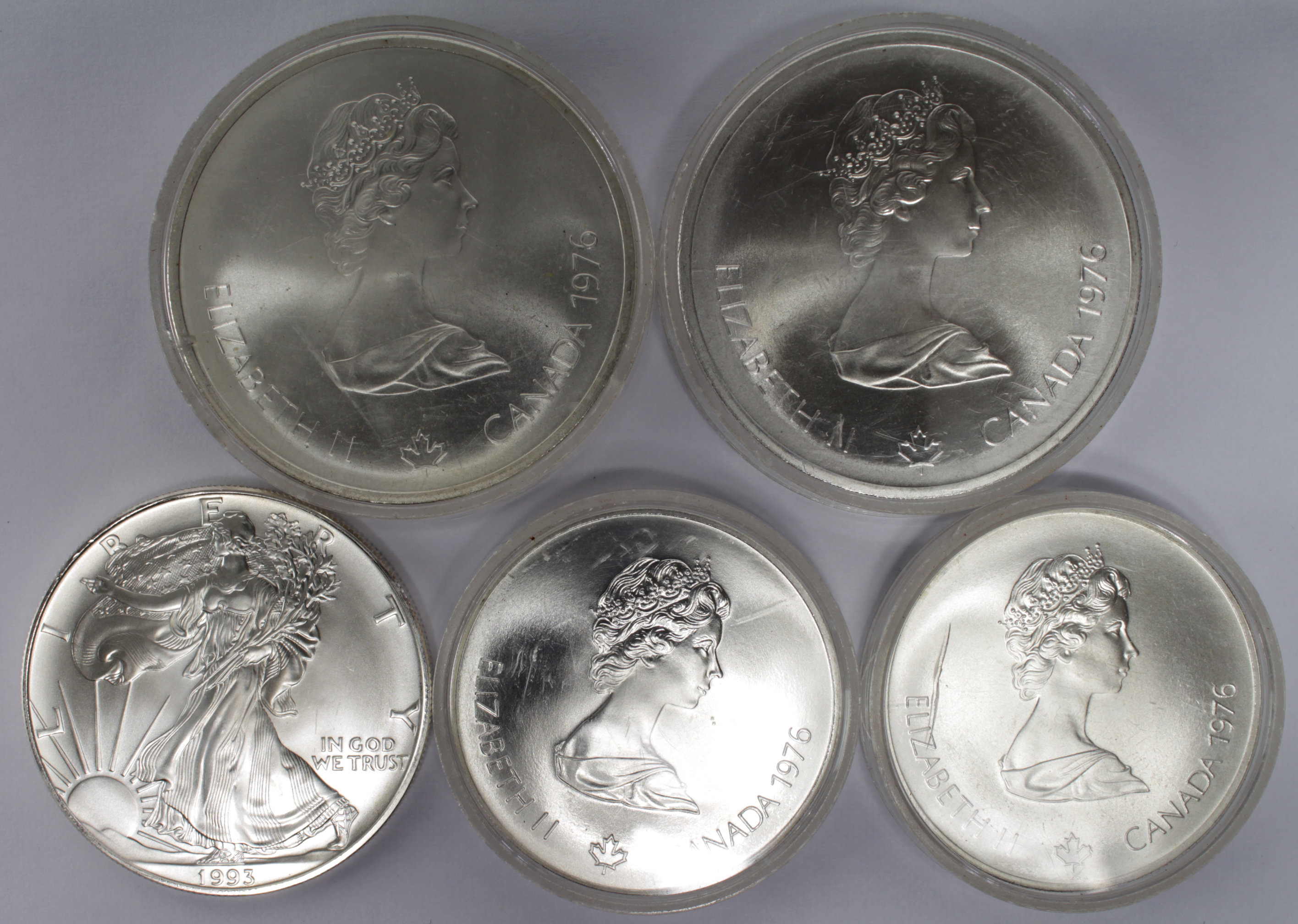 Canada (4) Olympics 1976 silver coins various crown-size upward AU-UNC, plus a USA silver Eagle 1993