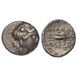 Ancient Greek silver hemidrachm of Myndos, Caria, obverse:- Head of young Dionysos right, wreathed